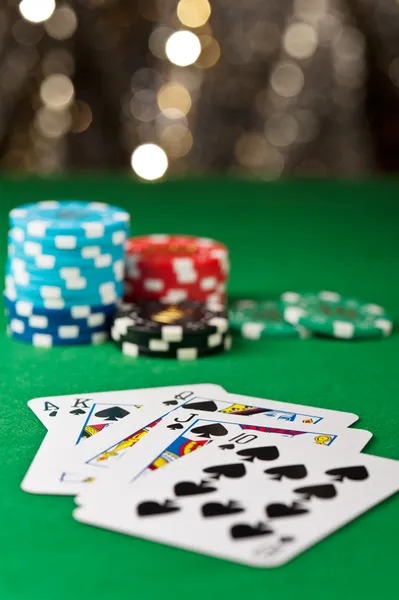 Live casino dealer at blackjack table with multiple camera angles